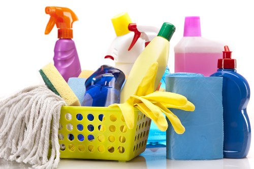 Carpet cleaning technician preparing equipment safely before starting work