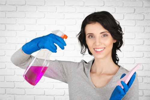 Professional carpet cleaner inspecting a room for hazards before cleaning